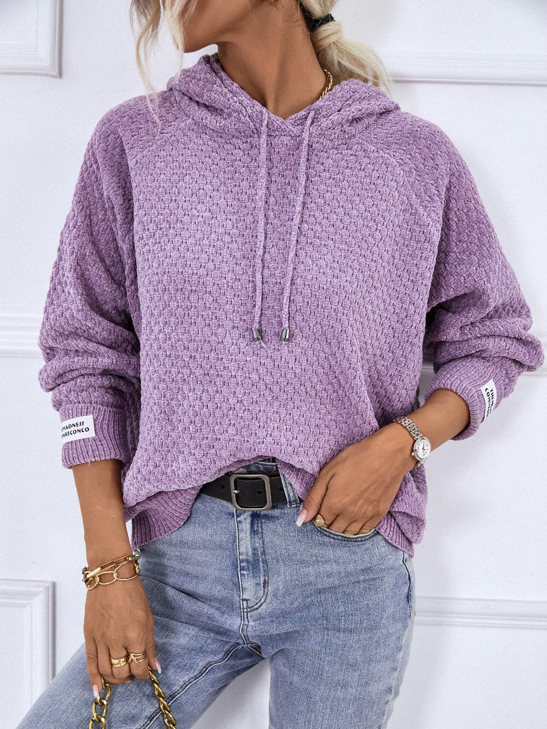 Lavender textured knit raglan sleeve hoodie with drawstring hood and cuff detail.
