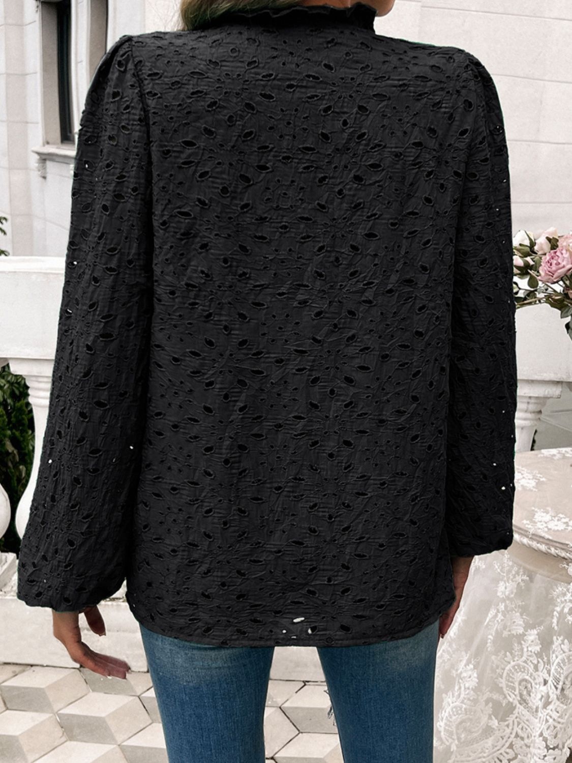 Black eyelet embroidered blouse with ruffle collar and puff sleeves, casual style.