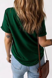 Dark green t-shirt with rolled sleeves and a subtle appliqué detail on the back.