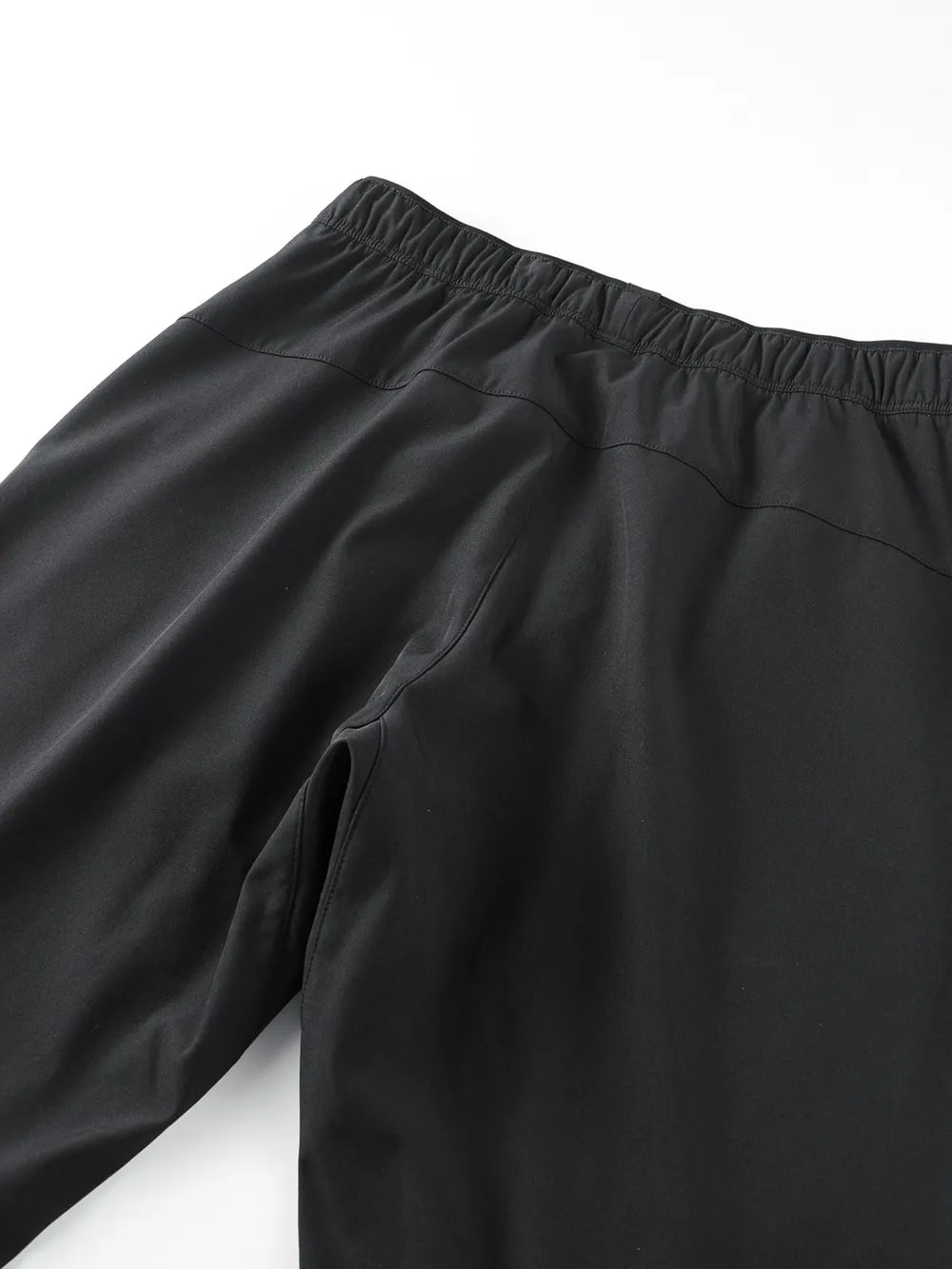 Black plus size men's sweatpants with elastic waistband and side pocket detail.