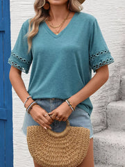 Blue-green V-neck t-shirt with lace trim on sleeves and a relaxed fit.
