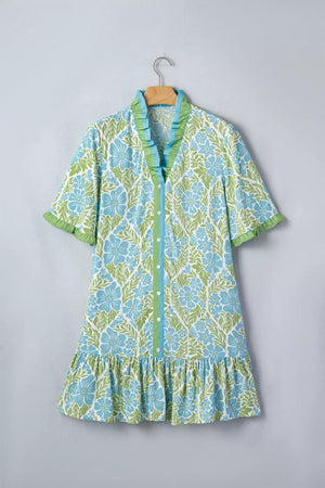 Charming floral mini dress with ruffled collar, cuffs, and hem.