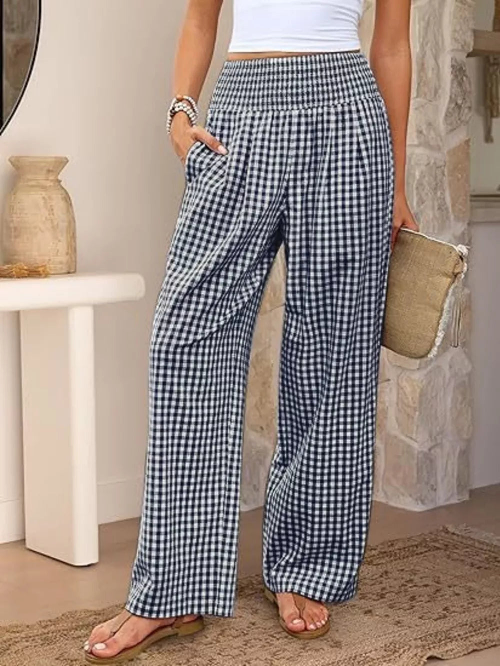 Navy blue gingham maternity pants with smocked waistband and wide legs.