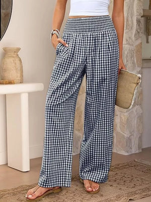 Navy blue gingham maternity pants with smocked waistband and wide legs.