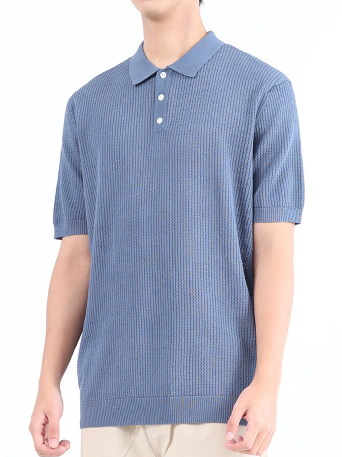Light blue textured knit polo shirt with classic collar and short sleeves.