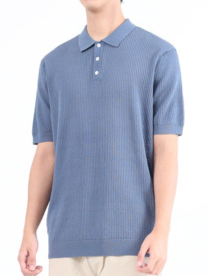 Light blue textured knit polo shirt with classic collar and short sleeves.