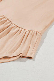 Peplum button-down top in Dust Storm cotton with ruffled hem detail