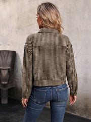 Cropped taupe houndstooth shacket with collared neckline and long sleeves.