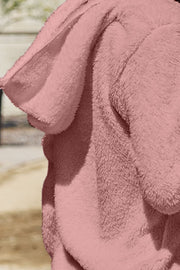 Plush hooded cardigan jacket in blush pink with a soft, fuzzy texture.