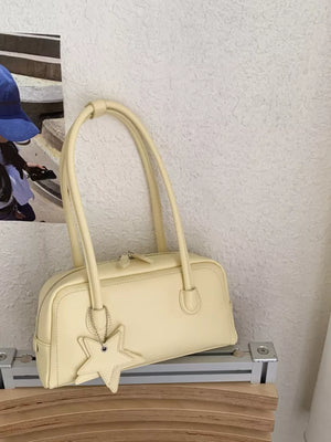 Yellow shoulder bag with star charm and double straps