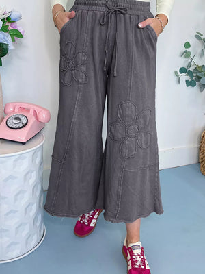 Floral embellished cropped wide-leg maternity pants in grey cotton with drawstring waist.