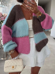 Pastel color block open front cardigan with balloon sleeves, worn with a white top and skirt.