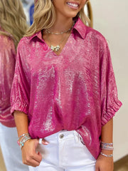 Lustrous collared V-neck metallic shirt in deep rose, with ruched sleeves.