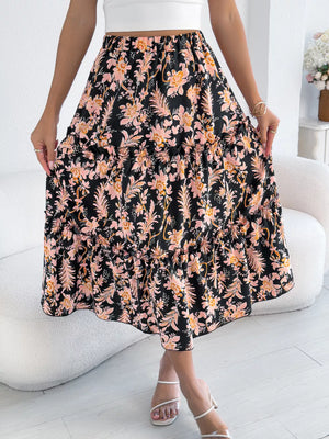 Midi skirt with floral print, ruffle hem, and tiered design.