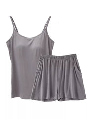 Gray cami and shorts pajama set with adjustable straps and pockets.