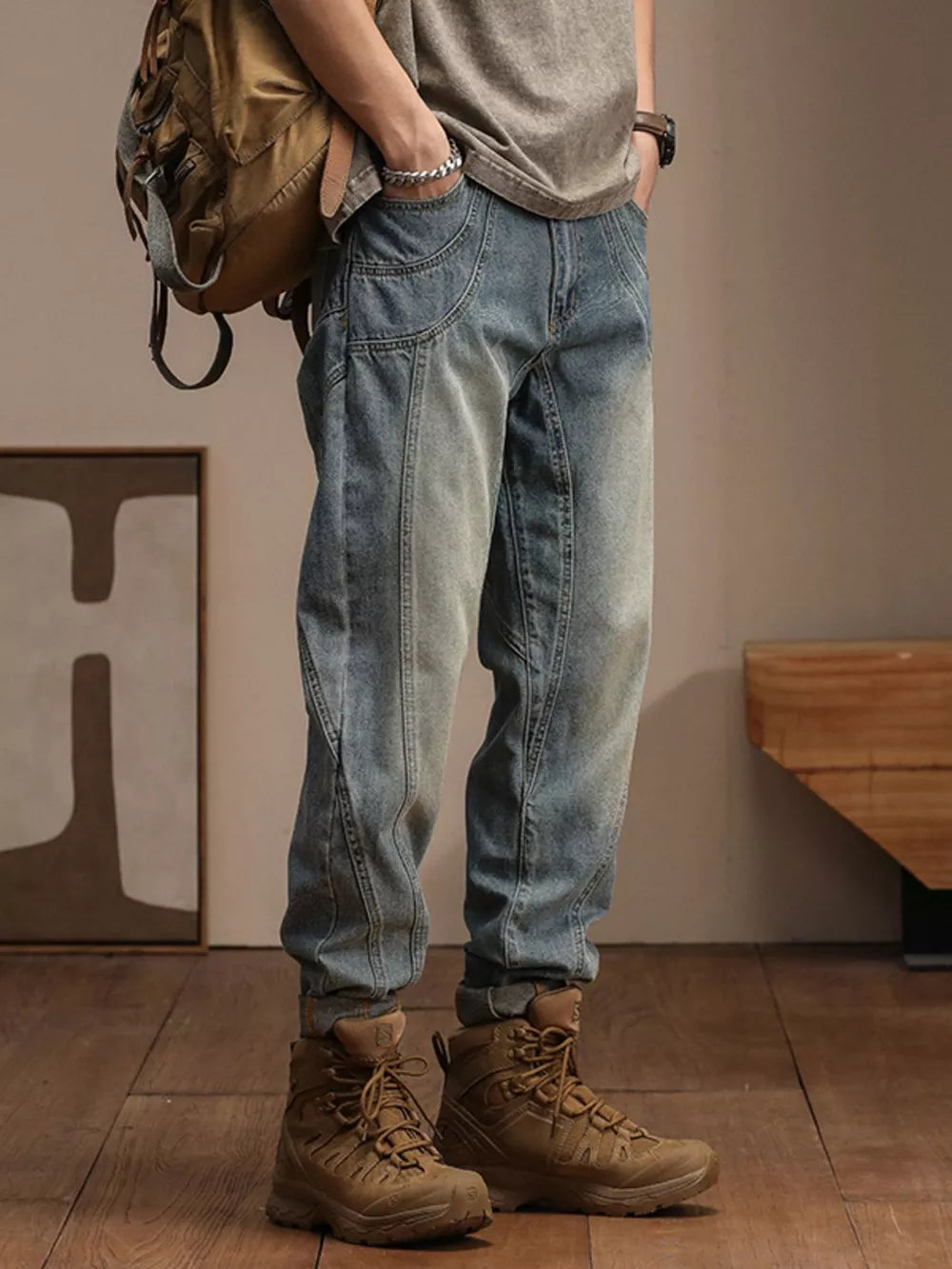 Relaxed fit vintage wash denim jeans with panel detailing and a light blue wash.