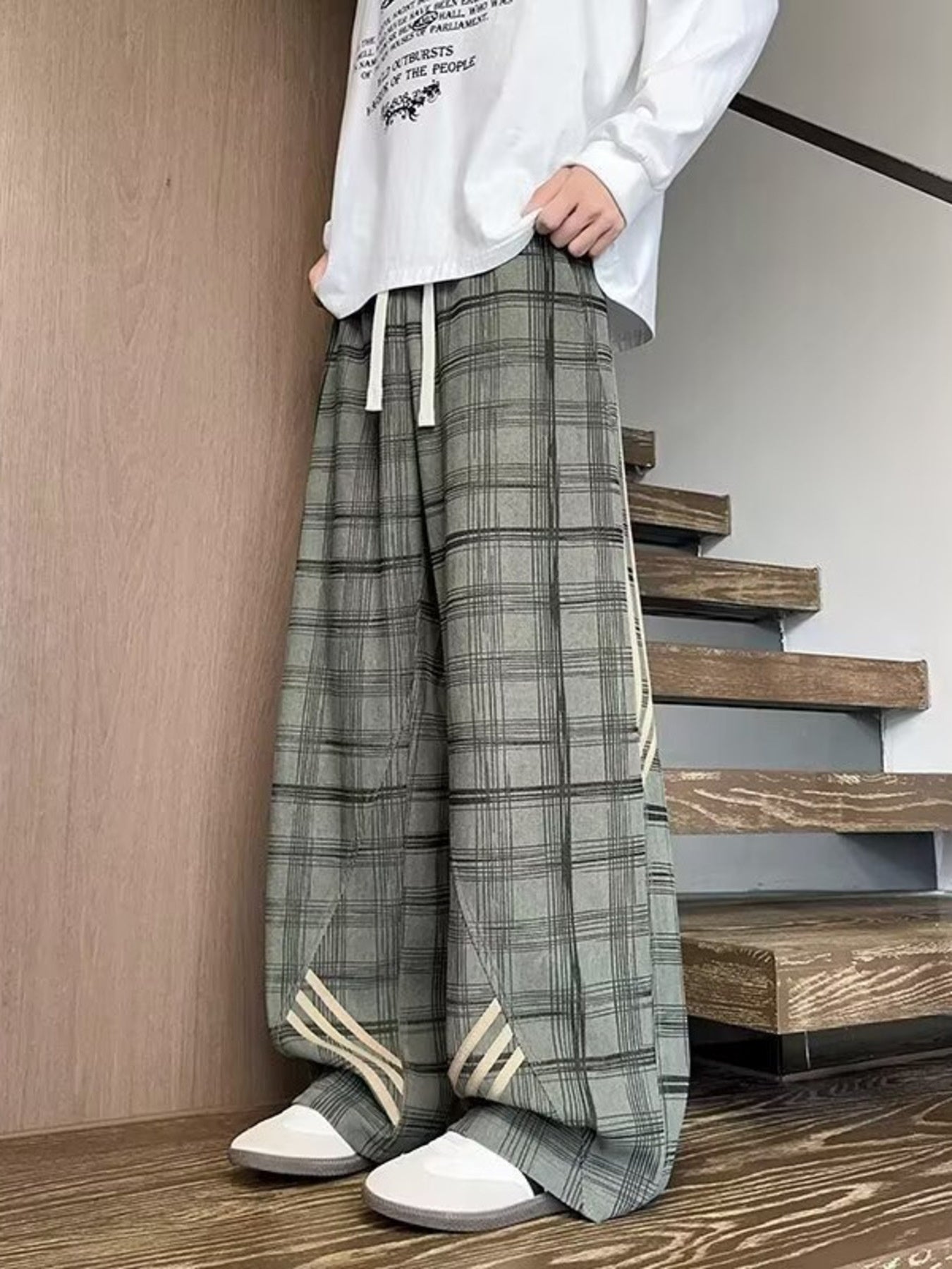 Men's gray plaid wide leg sweatpants with drawstring and side stripe detail