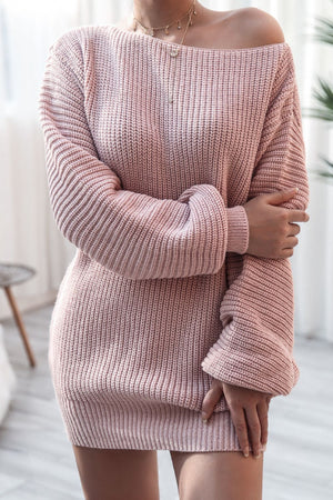 Off-the-shoulder ribbed knit mini dress in blush pink with long sleeves.