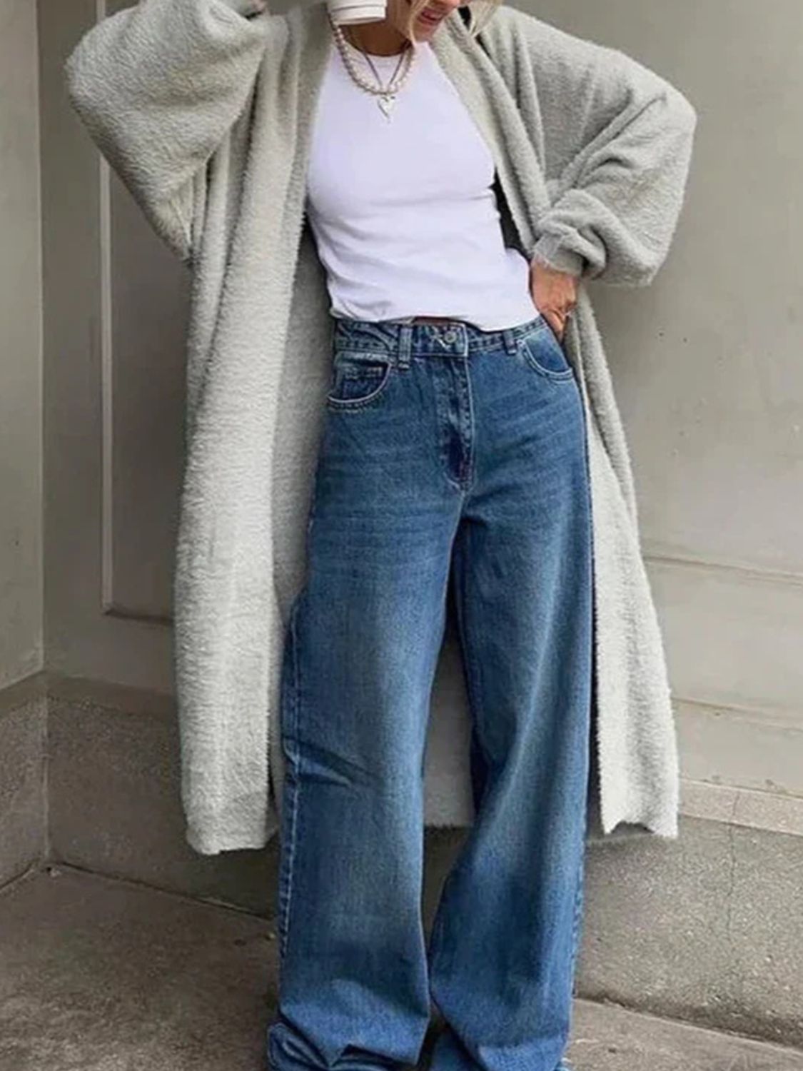 Light gray plush maxi cardigan with balloon sleeves worn open over a white top and jeans.