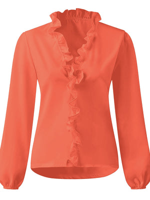 Pumpkin blouse with cascading ruffle front and balloon sleeves.