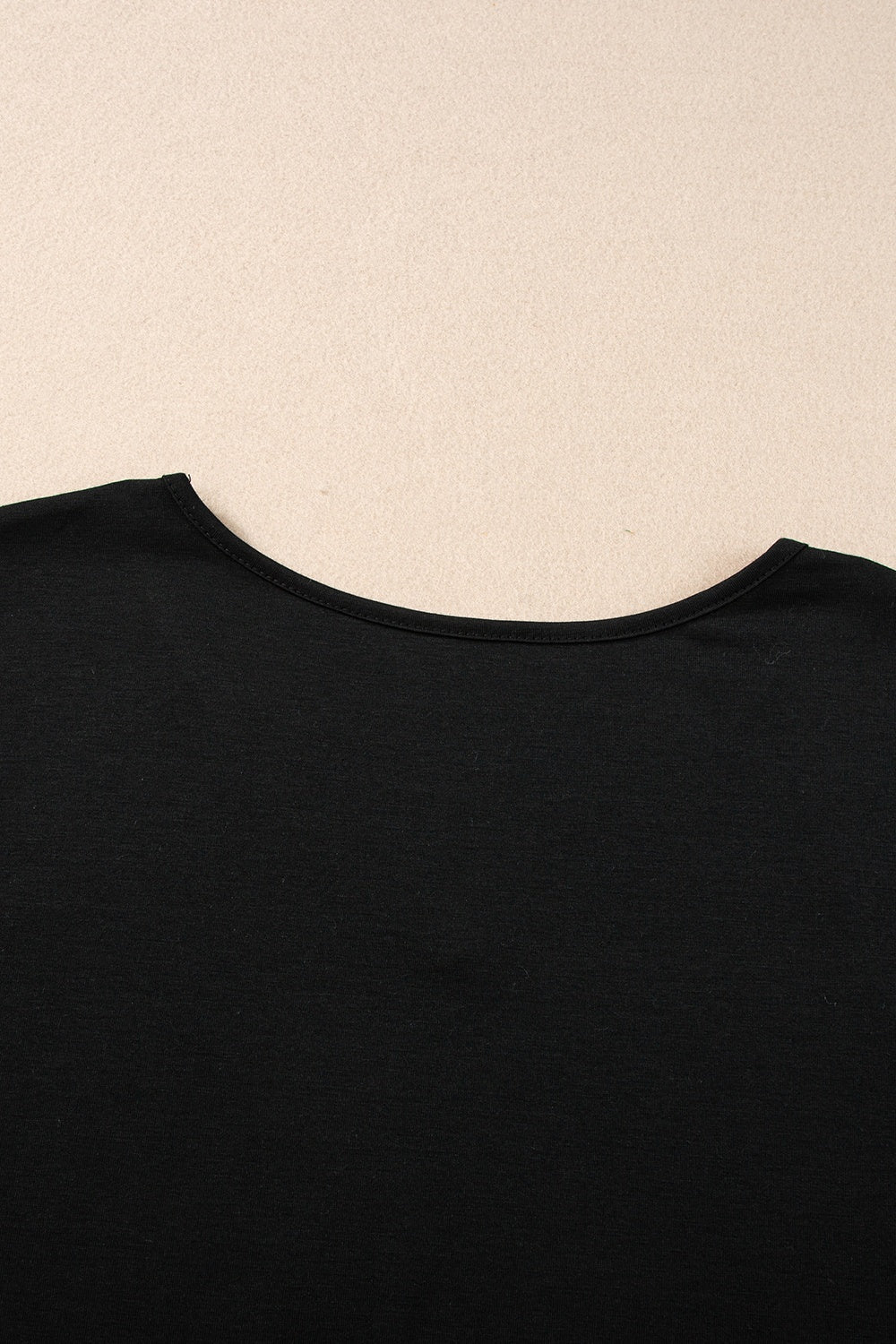 Black dolman sleeve blouse with round neckline detail