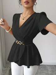 Black surplice blouse with flutter sleeves and a gold chain belt, polyester.