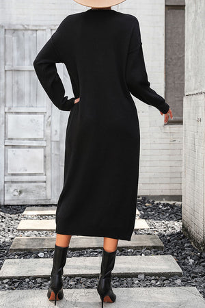 Black textured knit henley midi dress with long sleeves and a button neckline.