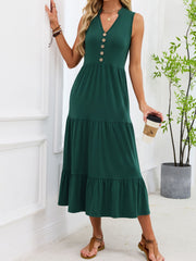 Dark green tiered midi dress with notched V-neck and decorative buttons.