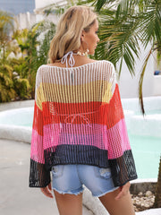 Rainbow mesh cover-up with flared sleeves in white, yellow, red, pink, and black stripes.