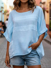 Blue relaxed fit blouse with horizontal stripe detail and front pockets.