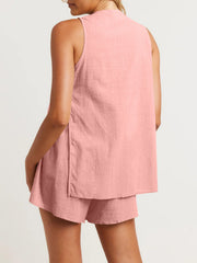 Cut-out back linen co-ord set in Burnt Coral, sleeveless top with side slits and matching shorts.