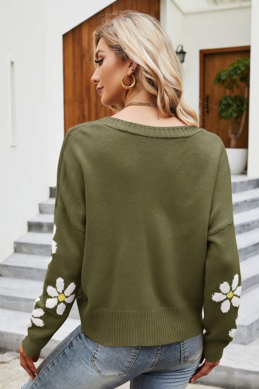 Green knit cardigan with daisy embroidery on sleeves, crew neck, acrylic.