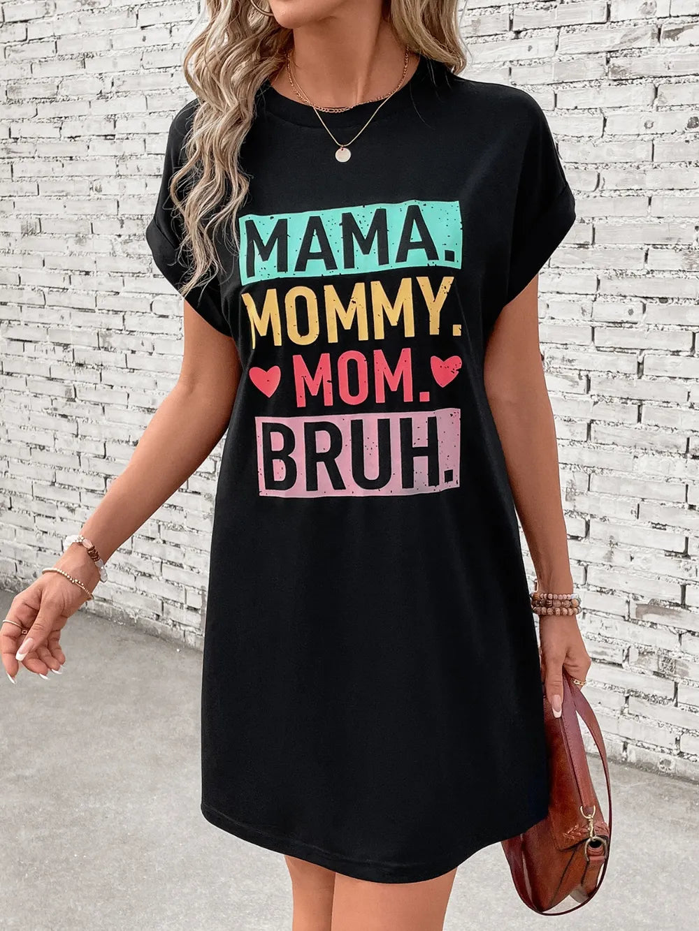 Black graphic tee dress with Mama Mommy Mom Bruh text and hearts, crew neck, short sleeves.