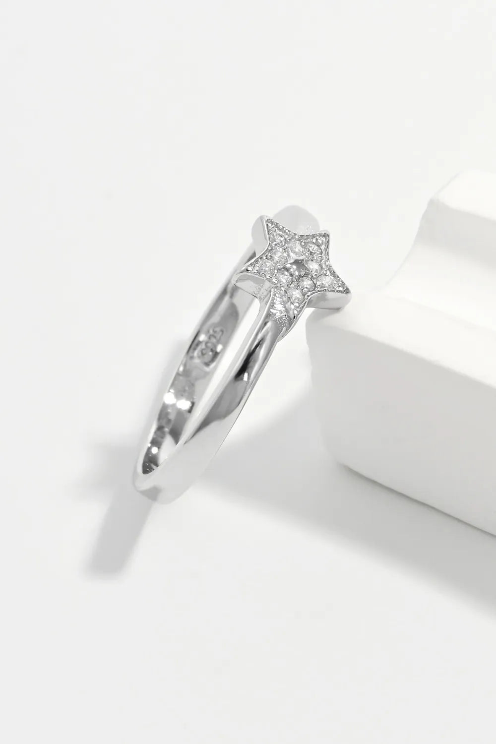 Silver ring with a diamond-encrusted star design