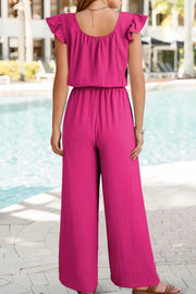Hot Pink textured ruffle-sleeve drawstring palazzo jumpsuit with wide legs.