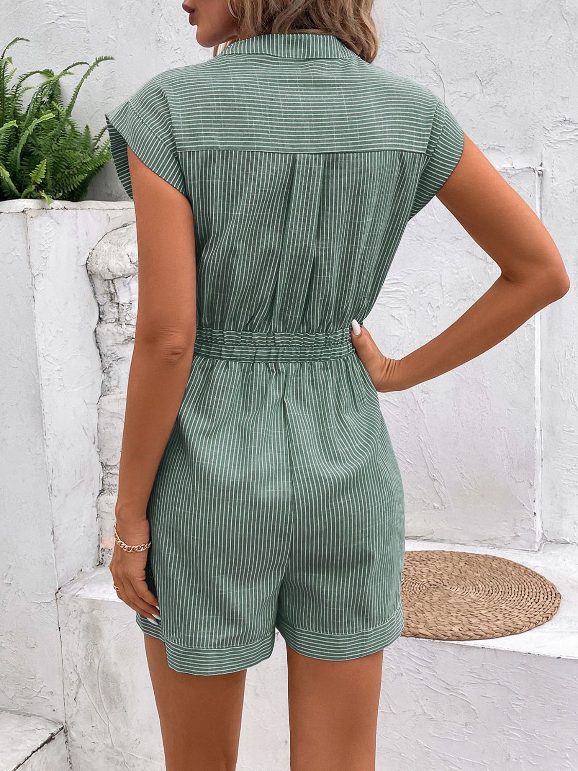 Gum Leaf striped shiriting romper with cap sleeves and elastic waist tie detail.