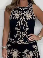 Black embroidered tank top and shorts set with ornate floral details.