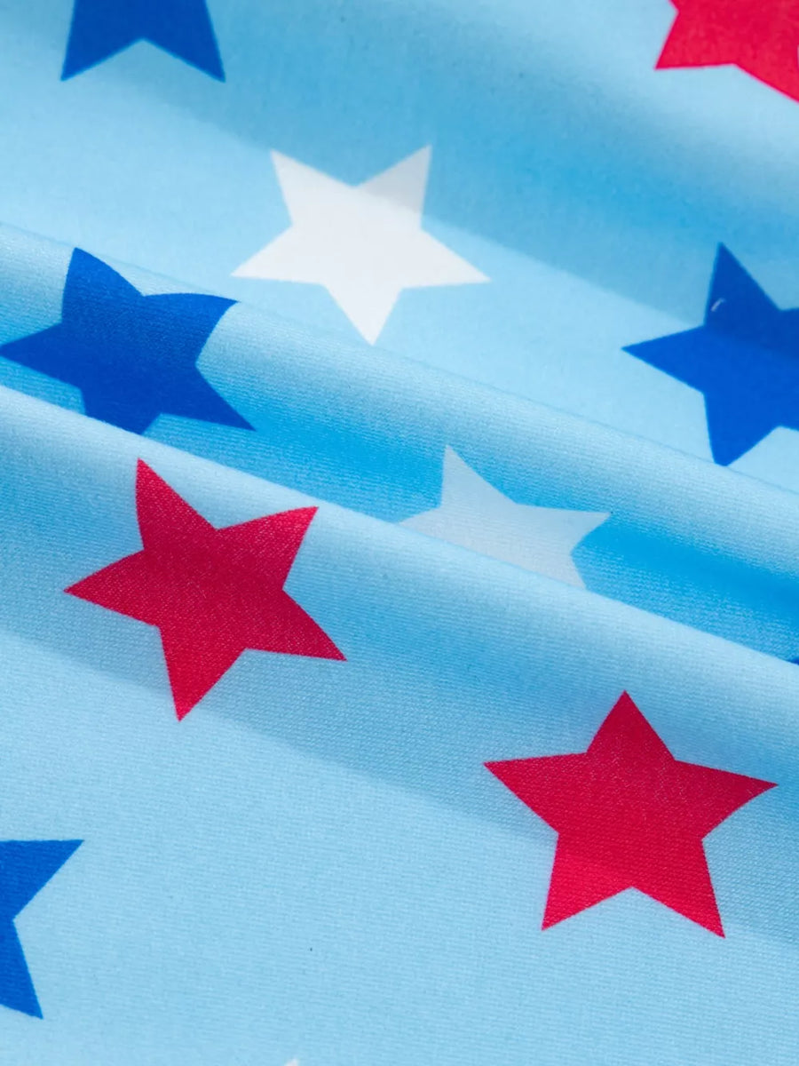 Starry drawstring mini skort with pockets in blue with red and white stars.