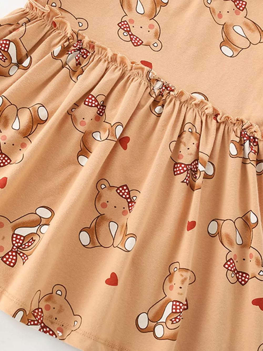 Baby dress with bear print and ruffle hem detail in cotton blend fabric.