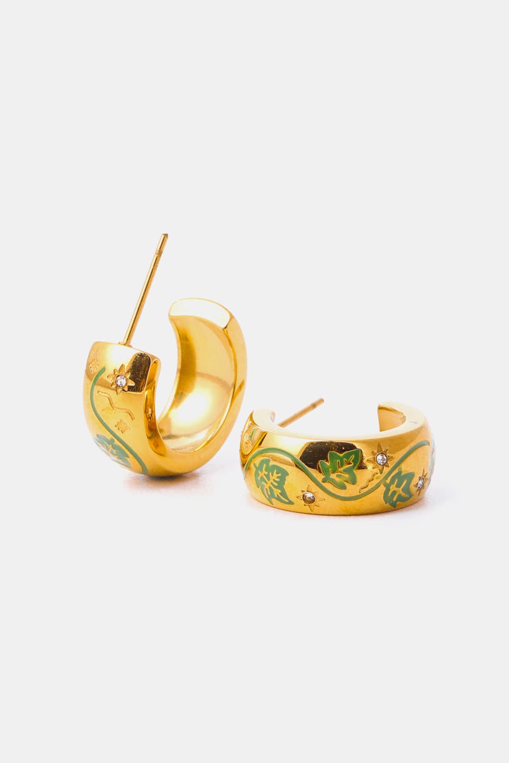 Gold hoop earrings with green floral enamel and small crystal accents