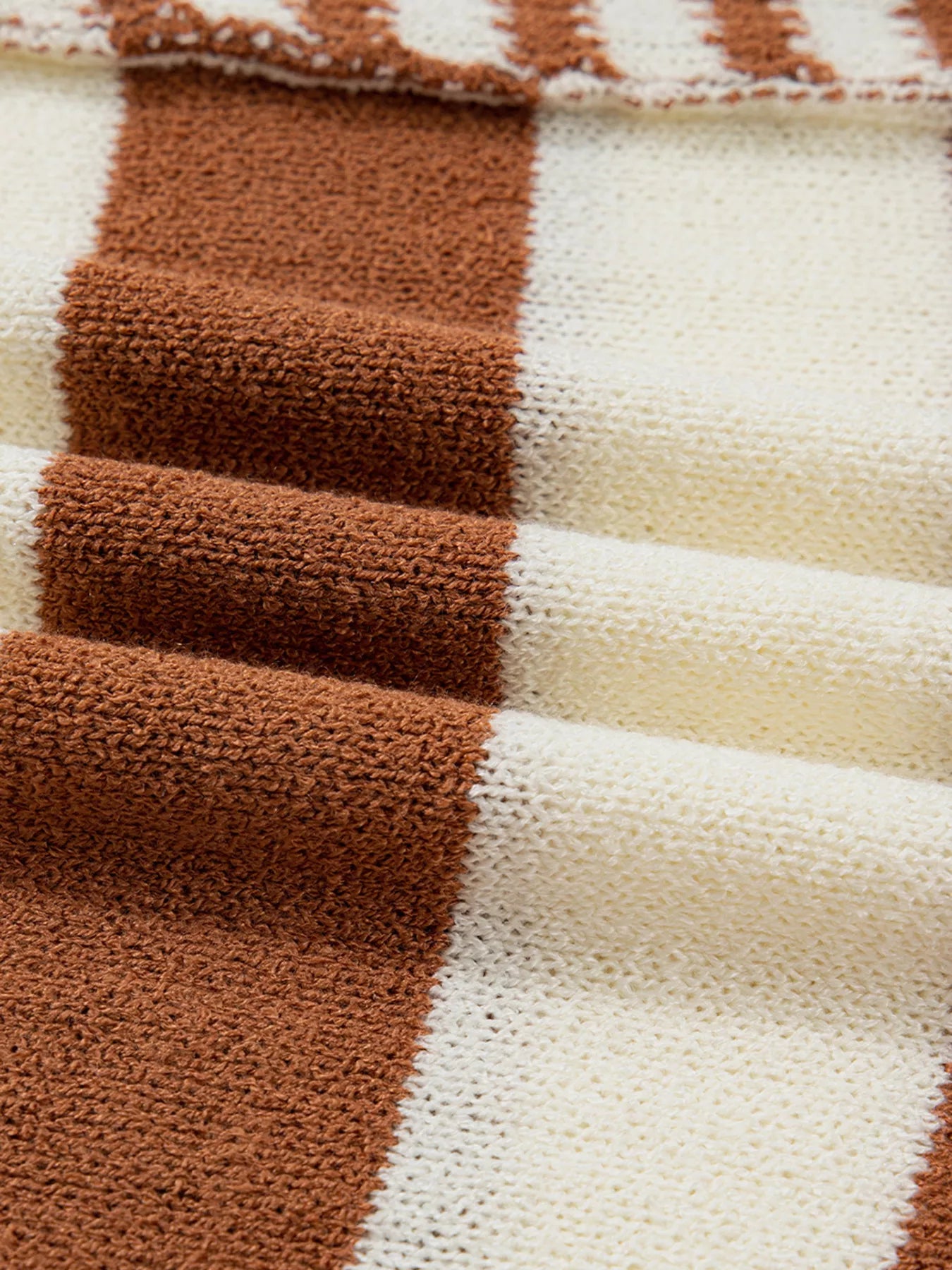 Patchwork striped acrylic sweater in caramel and cream with a soft, textured knit.