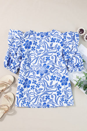 Blue floral print blouse with ruffled sleeves and a breathable casual cut.