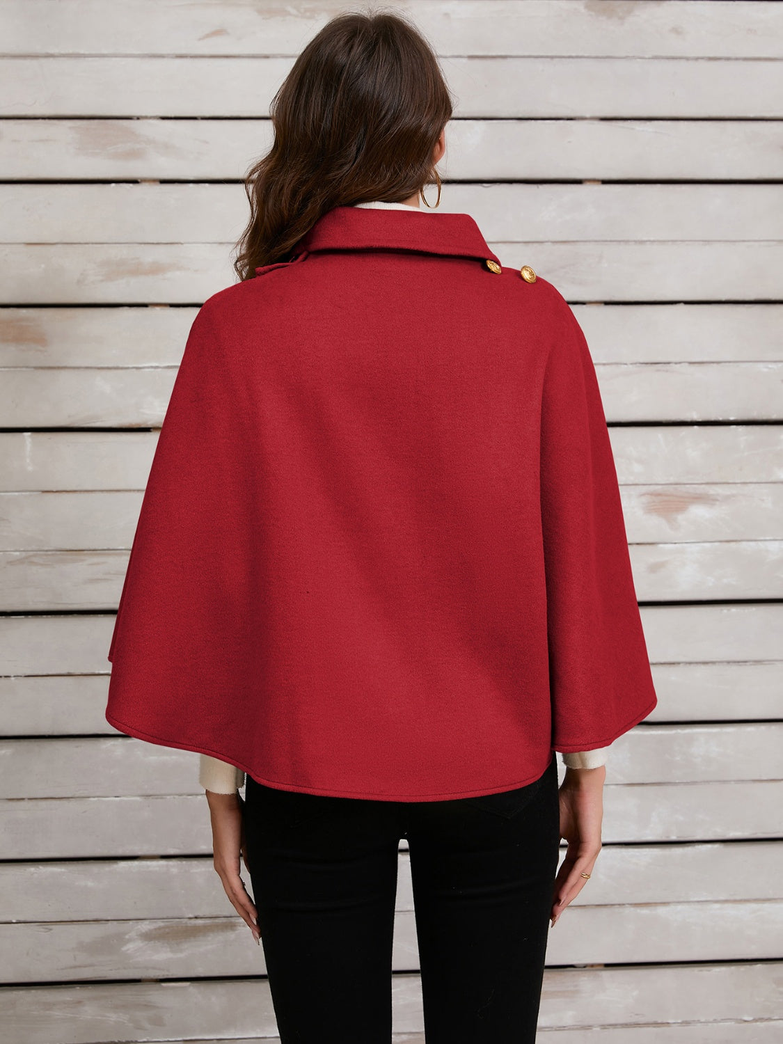 Deep Red asymmetric cape jacket with gold button detail and collar.
