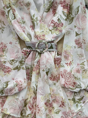 Floral ruffle hem wrap mini dress in light blue with long sleeves and a cinched waist belt.