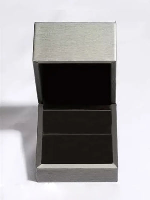 Silver jewelry box with open lid and dark interior compartments