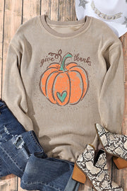 Ribbed tan sweatshirt with pumpkin graphic and "give thanks" text.