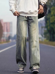Relaxed fit jeans in a faded blue wash, made of 100 cotton with a drawstring waist.