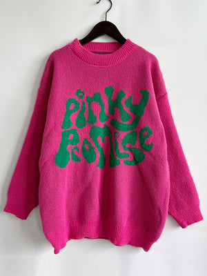Pink knit jumper with green "Pinky Promise" graphic text, crew neck, long sleeves.