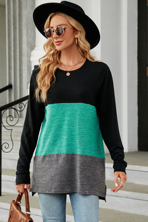 Colorblock long sleeve tee with teal and gray panels and slit hem.