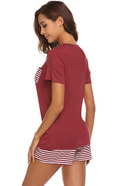 Burgundy V-neck lounge set with striped pocket and shorts.